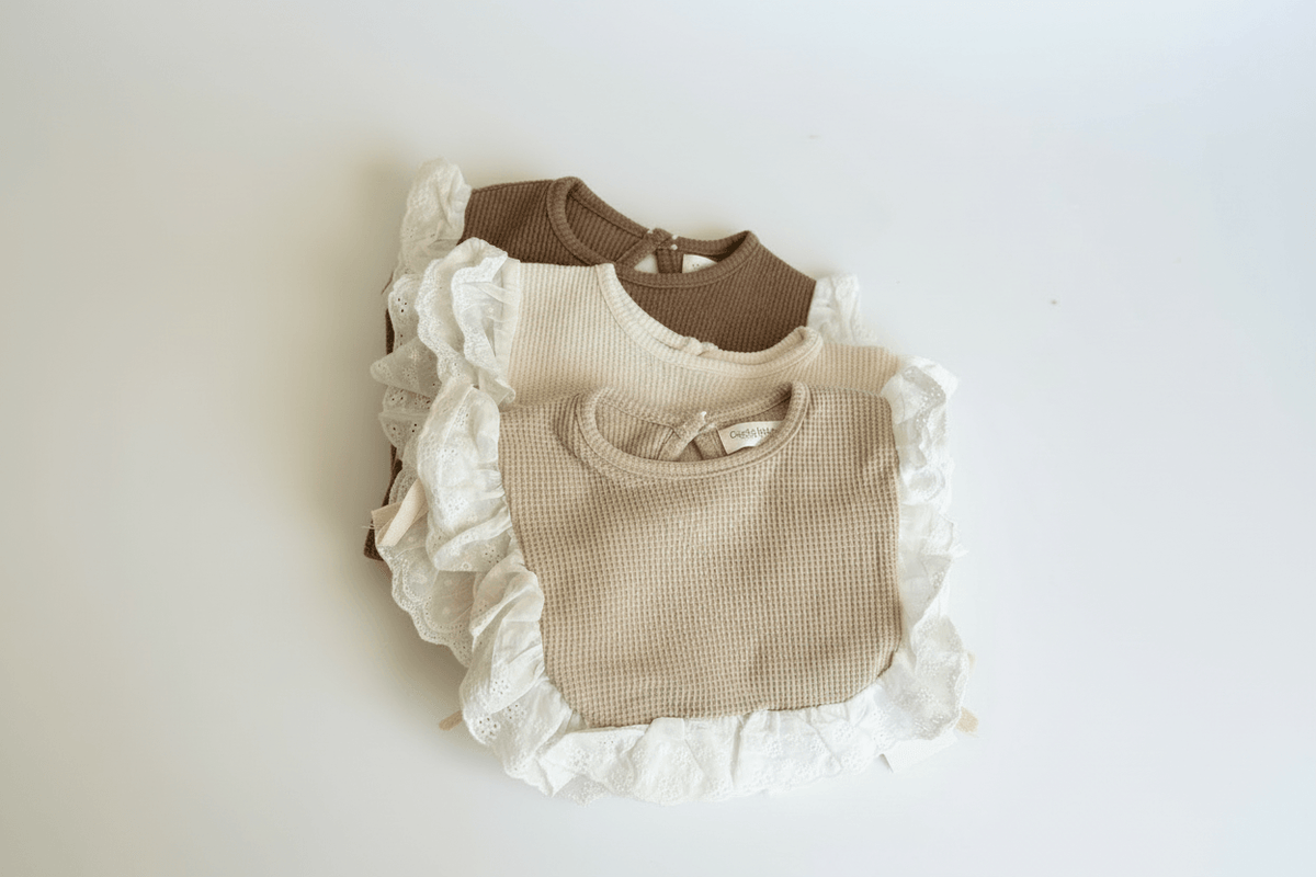 Essentīals Lace Bib - Stylish, Soft, and Practical Baby Bib